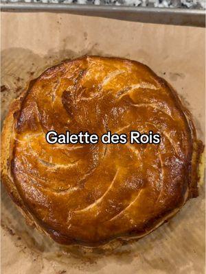 Galette des Rois. I made so many of these when I was an intern (stagiaire) at Fauchon in Paris way back when. This delicious frangipane-filled tart is the French way to celebrate Epiphany on January 6, but of course, it stays around all month in France. Traditionally there’s a fève (ceramic figure, I use a pecan) hidden inside the tart and whoever finds it in their piece is crowned king or queen for the day. Use store-bought puff pastry; look for one made with butter if you can find it (Dufour, Trader Joe’s). You don’t need a special pan, just a plate or bottom of a pan to make your circles.  Almond Cream (Frangipane): 7 T (100g) unsalted butter, melted ¾ c (75g) confectioners’ sugar 1 c (100g) almond flour Pinch salt 1 t rum or cognac (optional) 2 eggs, room temperature 1 t vanilla bean paste, or extract ¼ t almond extract (optional) 1 package store-bought puff pastry, rolled to make 2 9” circles of dough 1 whole almond or pecan for the fève  1 egg yolk beaten with 1 teaspoon milk for egg wash Transfer dough to a sheet pan lined with parchment and keep refrigerated while you make the almond cream. Add sugar, almond flour, salt, and rum to the melted butter and stir until smooth and uniform. Add the eggs, vanilla, and almond extract and beat in until smooth. Remove sheet pan from the refrigerator and spread almond cream on bottom dough circle, leaving a 1” border all around. Hide the fève in the filling. Brush exposed border liberally with egg wash. Place second dough circle on top and seal the edges. Use a fork or your fingers to press down edges creating a decorative border. Chill galette in the refrigerator for 20 minutes while preheating oven to 400 degrees. Remove galette from fridge, brush top with egg wash. Try to not let it drip down the sides as this will inhibit the rise. Use the tip of a paring knife to etch a design and cut 5 vents in the top to allow steam to escape. Bake in lower half of the oven until golden and puffed, 30-40 minutes. Slide onto a cooling rack. Serve warm or room temperature. Best eaten the day it’s made.  #chouquettekitchen #bakeathome #bake #galettedesrois #kingcake #epiphany #dessert 