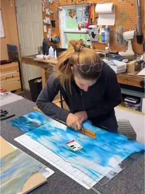 Cutting out a 30” continuous sky section for a Three Sisters landscape panel installed in clients interior transom.  . . #stainedglassartist #stainedglassart #landscape #threesisters #stainedglass #stainedglassdesign #asmr #glassart 