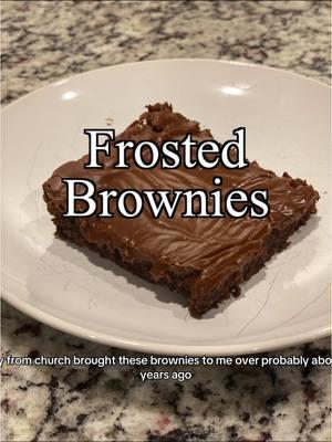 These Frosted Brownies have a special place in my heart! 💕 A sweet friend from church brought them over when I had my second baby, and I’ve been hooked ever since. They’re perfectly fudgy, topped with rich chocolate frosting, and so easy to make! Fun fact: When I posted these last time, the video went viral with millions of views—and for good reason! These brownies freeze beautifully, too. I even saved one and gave it to my husband for his birthday. 🥳 Whether you’re making them for a special occasion or just because, you can’t go wrong with these brownies. Tag me if you try them—I’d love to see your creations! Ingredients Brownies: •	1 ½ cups melted butter •	3 cups sugar •	3 teaspoons vanilla extract •	6 eggs •	1 ½ cups all-purpose flour •	1 cup unsweetened baking cocoa •	3/4 teaspoon baking powder •	3/4 teaspoon salt Frosting: 	•	½ cup butter, melted 	•	½ cup unsweetened cocoa powder 	•	1/4 cup corn syrup 	•	½ teaspoon vanilla extract 	•	3 cups powdered sugar 	•	3-6 tablespoons milk Instructions Making the Brownies 1.	Preheat your oven to 350°F. 2.	In a large bowl, mix together the melted butter, sugar, vanilla, and eggs until smooth. 3.	Add the flour, cocoa powder, baking powder, and salt. Mix until just combined. 4.	Pour the batter into a greased 9x13-inch baking pan, spreading it evenly. 5.	Bake for 20-25 minutes, or until a toothpick inserted in the center comes out with a few moist crumbs. 6.	Let the brownies cool completely in the pan before frosting. Making the Frosting 	1.	In a medium bowl, combine the melted butter, cocoa powder, corn syrup, and vanilla. Mix until smooth. 	2.	Gradually add powdered sugar and 3 tablespoons of milk, mixing until well combined. 	3.	Add additional milk, 1 tablespoon at a time, until you reach your desired frosting consistency. 	4.	Spread the frosting evenly over the cooled brownies. #FrostedBrownies #ChocolateLovers #FudgyBrownies #BakingInspiration #DeliciouslyBold