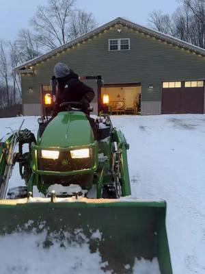 Plowing snow with the John Deere 2025r bucket skis. #fyp #johndeere #compacttractor #snowplowing #snow #winter #2025r 