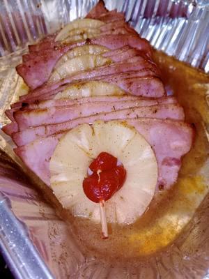 honey baked ham  Ingredients: 1 Smithfield Half Brown Sugar Ham 1 can (about 20 oz) pineapple slices, drained (reserve juice) 1/2 cup pineapple juice (reserved from the can) 1/2 cup honey 1/2 cup brown sugar 1/4 cup regular sugar nutmeg  1 tsp cinnamon sugar 1/2 tsp ground cinnamon 1/4 tsp nutmeg 1/4 tsp paprika Slap Your Mama seasoning (to taste) Maraschino cherries (optional, for garnish) Instructions: Preheat the oven to 325°F (165°C). Prepare the ham: Place the Smithfield half brown sugar ham on a roasting pan or baking dish. Score the ham in a diamond pattern if it isn't pre-scored. This will allow the glaze to penetrate the meat. Make the glaze: In a medium bowl, whisk together pineapple juice, honey, brown sugar, regular sugar, cinnamon sugar, cinnamon, nutmeg, paprika, and a pinch of Slap Your Mama seasoning. Apply the glaze: Pour half of the glaze over the ham, making sure to coat it evenly. Place the ham in the preheated oven. Bake the ham: Cook the ham for about 15–20 minutes per pound, or until heated through. Baste with the glaze every 20 minutes to ensure it stays juicy and flavorful. Add pineapple slices: After about an hour, arrange pineapple slices on top of the ham and secure with toothpicks. You can add maraschino cherries inside or around the pineapple slices for extra flavor and garnish. Finish baking: Continue baking until the ham reaches an internal temperature of 140°F (60°C) and is golden and caramelized. Rest the ham: Once done, remove the ham from the oven and cover it loosely with foil. Let it rest for 20 minutes to allow the juices to redistribute before slicing. Serve: Slice the ham and serve with the roasted pineapples and any extra glaze. This method will ensure your ham is perfectly cooked, juicy, and full of flavor! Enjoy! #bakedham #honeyglazed #ham #foodieblogger #easterdinner  #recipes #easterrecipes #fypシ #thanksgiving #cookingformyhusband #cookingformyfamily  #CookingHacks #holidaydinner #mealsmadeeasy  #cookingwithcoco 