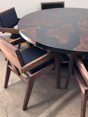 60” round Claro Walnut table with black resin. Paired with a matching set of oir Lusso armchairs. Wrapped up before Xmas ——— Visit our website or instagram to see more. All custom made to order. #customtable #chairset #diningset #kiwiwoodshop 