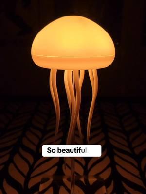 This rechargeable color changing jellyfish light is so satisfying. This unique home decor find is sure to impress. Add beautiful ambient mood lighting to your space with this unique find. #homedecorfinds #jellyfishdecor #jellyfishlamp #jellyfishlight #uniquefinds #colortherapy #satisfyingvideos #uniquedecor #moodlighting #ambientlight 