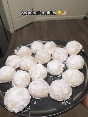 Best Snowball cookies  Ingredients 1 cup unsalted butter, softened ½ cup powdered sugar 1 teaspoon vanilla extract 2 ¼ cups all-purpose flour 1 cup very finely chopped (walnuts/pecans) ¼ teaspoon salt ⅓ cup powdered sugar, or more as needed Preparation Preheat the oven to 350 degrees F (175 degrees C). Bake in the preheated oven until bottoms are light golden brown but tops are still pale 12 to 15 minutes. (Try not to let cookies get too brown: it's better to undercook them than to overcook them.) Remove cookies from the oven and let them sit on the baking sheets. Place 1/3 cup powdered sugar in a shallow bowl; roll hot cookies in sugar to coat, then return to cool. Once cooled, roll cookies in the powdered sugar once more. #snowballcookies #Recipe #besitosdenuez #cookie #powdersugar 