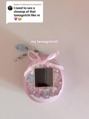 Replying to @Allimewz it’s a pink fairy on that I replaced the faceplate paper of & added a bow too :p pushing out the faceplate was so hard and I snapped one of the prong thingys 😭😭😭 #tamagotchi #mamegoma #sanx 