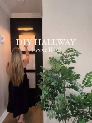 Before and after of my hallway!  This was such an easy DIY project and only took me one day to complete! I used the leftover shiplap from our fireplace build and added this accent wall in the hallway outside our master bedroom.  I love how it all flows now in the living room (check out the stories and story highlight “hallway” to see!)  I also wrote a blog post with all the how to’s so check that out also if you plan on tackling this project yourself! Paint color is “tricorn black” by Sherwin Williams  I debated lots on keeping the baseboard white or painting black - but, my gut said paint - and I think I love it! I feel like it extends the wall and makes it appear taller.  I also painted my baseboards black on the fireplace, so overall I just feel like it flows!  I then added these large Matted Frames and a battery-powered/ rechargeable picture light. So no wiring is needed, you simply just screw the base to the wall and the light pops on and off easily when you need to recharge!  It’s also super affordable - under $40! And comes in 6 different finishes and two different sizes. Mine here is the “Antique Brass” and 16”. What do you think?!  #hallwayinspo #shiplapwall #accentwall #hallwayinspiration #hallwayideas #hallwaystyle #hallwaystyling #gallerywall #blackpaint #blackwall #tricornblack #featurewall #neutraldesign #homedesign #homeaesthetics #diyhome #DIY #homediy #picturelight