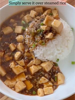 Vegan Mapo Tofu, Soft tofu with minced shiitake mushrooms in a spicy sauce made with Sichuan Chili Crisp and spicy bean sauce, along spicy mouth numbing Sichuan pepper! Find detailed recipe link in my bio I am sure many of you have tried this spicy cozy dish over steamed rice, but have you mix it with your instant noodles?!?! I LOVE mixing this with Maggi, it is truly spicy cozy hug to your belly especially in this cold weather. Try it and thank me later! #mapotofu #mapotofurecipe #tofurecipe #plantprotein #proteinpacked #quickrecipes 