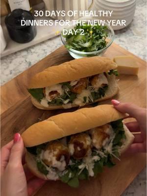 DAY 2/30: Chicken Caesar Meatball Subs. 🥪🥗 These are inspired by another creator on here (can’t remember who) and I HAD to try to create them for dinner. Can’t wait to make these again!🤌🏻 •••••• Ingredients: Sub Rolls or Bolillo Rolls 1 lb ground chicken 2 tbsp  Caesar dressing + more for topping 1/2 cup breadcrumbs 1 egg 1/4 cup shredded or grated parmesan + more for topping 1 tsp each: garlic powder, salt,  pepper Romaine lettuce  •••••• Instructions: 1. Add ground chicken, egg, breadcrumbs, seasonings, 2 tbsp Caesar dressing & 1/4 cup parmesan to a large bowl. 2. Mix well and form golf ball sized meatballs. 3. Heat a large pan over medium heat and add avocado oil. 4. Add meatballs to pan and cook covered for about 15 minutes, flipping occasionally until meatballs are browned on both sides.  5. Toast your sub rolls in the oven on a low broil for just a couple of minutes. Cut them open if they are not already. 6. Assemble subs: Caesar dressing, lettuce, parmesan, meatballs Enjoy! Feel free to customize these however you’d like! •••••• #healthyrecipes #DinnerIdeas #healthydinnerideas #groundchickenrecipe #subsandwiches #highproteinmeals #chickencaesar 