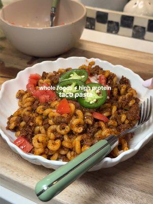 HIGH PROTEIN TACO PASTA 👩🏼‍🍳🍅🍜🌮🌶️ recipe below!  INGREDIENTS:  - 1 pound ground beef  - 8 oz pasta sauce (I’m using @SAUZ) - 1 pkg protein pasta (I’m using @GOODLES) - 1 yellow onion (diced)  - 1 can diced green chiles  - 2-3 cloves minced garlic  - 2 tsps cumin  - 1 tsp smoked paprika - 1 tsp oregano  - 1 tbsp chili powder  - 1/4 tsp black pepper  - 1 tsp sea salt  TOPPINGS:  - pico (1 tbsp diced onion, & 1 diced roma tomato)  - 1 thinly sliced jalapeño - Whatever your heart desires 🫶🏼 INSTRUCTIONS:  - start by dicing your onion. Reserve 1 tbsp for later, then add the rest to a pan over medium heat with a splash of avocado oil. Sauté about 1-2 minutes. Then add in 1 pound of ground beef. Break it up til it’s brown.  - While we wait for that to brown, I brought some bone broth to a boil, add in my protein noodles and cooked according to package instructions. *reserve 1/4 cup of the pasta water before straining!  - Once the meat is mostly browned, add in your minced garlic, pasta sauce, 1/4 cup water, cumin, smoked paprika, oregano, chili powder, salt & pepper. Give it a quick mix then add in 1 can of diced green chiles. Mix then lower heat just slightly and allow mixture to thicken ~5-6 minutes.  - While we wait for that to thicken, I started prepping my toppings. I added my diced roma tomato to the bowl with my reserved diced onion from earlier. Sprinkled with some salt + pepper (you could also add a splash of lime juice if your heart desires!) thinly sliced my jalapeño. - By then your meat should be done, add in your drained pasta noodles, and reserved pasta water. Mix until everything is well coated in the sauce. Allow flavors to marry ~1-2 minutes, then it’s time to plate!  - add your toppings & serve !!  Soooo yummy, seriously you’ll be obsessed 😍 @Simply Organic @Caraway Home @Primal Kitchen Foods #proteinpasta #highprotein #proteinpacked #highproteinrecipes #wholefoodsdiet #dairyfreerecipes @#glutenfree #glutenfreerecipes #dairyfreerecipes 