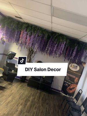 I love having a vibe that everyone else doesn’t have. Your #flowerwall don’t look like mine. #wisteria #wisteriatree #salondecor #luxury #relaxingenvironment #itsavibe #baddiesonly #blessedbyarena #blessedhairstudio #dyi #wisteriadecor #purple #purplesalon #hair #hairsalon #fyp