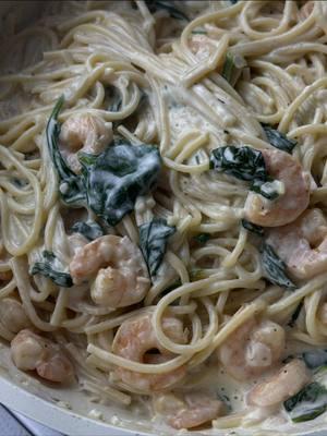 Creamy shrimp pasta 🤍🍤🍝 ingredients for shrimp  - 1 pound of peeled and deveined shrimp  - 1 tbsp of olive oil  - paprika  - lemon pepper seasoning  ingredients for sauce  - 1 shallot; diced small  - 1 tbsp of minced garlic  - 1 1/2 cups of heavy cream - 1/2 cup of broth + 1/2 tbsp of corn starch  - 1/2 a lemon; juiced  - salt  - pepper  - garlic powder  - onion powder  - italian seasoning  - 2 large handfuls of spinach - shredded parmesan cheese  - 1/4 cup of pasta water (optional)  - 12 oz of spaghetti; cooked  Start by seasoning your shrimp and mix. Then heat a large pan on medium high heat. Once heated, add oil and then add shrimp and cook in batches if needed.  Cook on each side for 1-2 min until shrimp is pink and curled up. Remove from pan and set aside.  Either to the same pan or to another large pan add in more oil if needed. Then add in shallots and saute for 4-5 min. Then add in minced garlic and saute for another minute. Then add in heavy cream and let it some to a slight boil. Then add in broth and cornstarch mixture and mix. Then go in with lemon juice. Then add seasonings in. Add in spinach and let wilt. Add on shredded parmesan cheese.  Then for the pasta; i didn’t drain it and i added it directly from the pot with water into the sauce using tongs. This adds some pasta water to the sauce which is perfect. If not, reserve about 1/4 cup of pasta water then drain your pasta and add pasta water as you need.  Then add in shrimp and mix. Remove from heat and let sit for 5-10 min so sauce thickens and then enjoy! #creamyshrimppasta  #shrimppastarecipe #easy30mindinner #mukbang #fyp #trending #weeknightdinner #HealthyDinnerIdeas #shrimprecipes #easydinnerideas 