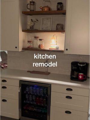 A little warmth in this bright kitchen! #storytime #kitchen #remodel #menards #cabinet #klearvue #stromma #quartz #drawerlighting #tile #farmhouse #cottagecore #DIY #renovation  #demo #shelves #shelf #stain #barcart #beveragefridge 