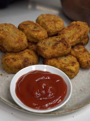 NOT “CHICKEN” NUGGETS INGREDIENTS For nuggets: 1 can young green jackfruit 1 can chickpeas (keep chickpea water) 1/2 black of pumpkin seed tofu (or extra firm tofu) 3 tsp salt and pepper  1 tsp smoked paprika  1 tsp paprika 1 tsp onion powder 1 tsp garlic powder  1/4 cup aquafaba  1/2 cup chickpea flour For dredges: Drained chickpea water for wet dredge 1 cup chickpea flour 3 tsp salt and pepper  1 tsp smoked paprika  1 tsp paprika 1 tsp onion powder 1 tsp garlic powder  INSTRUCTIONS Drain and rinse your jackfruit, then squeeze out as much liquid from them as possible with a clean kitchen towel. Tear into shreds and roast at 350ºF for 15 mins with a drizzle of oil, salt and pepper. Drain and rinse your chickpeas but keep the liquid that comes int he can (aquafaba). Mash chickpeas in a large mixing bowl then add roasted jackfruit, pumpkin seed tofu, spices, aquafaba, and flour. Mix until well combined then form your nuggets, lay on a tray and freeze for 30 mins. Then coat in seasoned flour, aquafaba then back in the flour to fully dredge. Fry on medium heat for 3-5 mins total or until golden and crispy. Serve and enjoy. • • • • • • • • #veganrecipes #vegancooking #vegan #veganfoodshare #plantbased #holisticliving #healthyfood #Foodie #whatveganseat #wholefoodplantbased #blackvegan #plantbasedcooking #veganchef #vegancook #veganmeal #veggierecipes #cookingtutorial #comfortfood #veganuary #newyear #newyearrecipes #chickennuggets #mcdonalds #vegannuggets