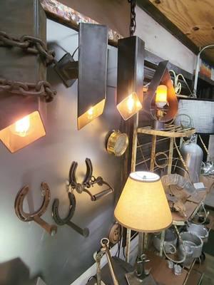 We have started a wall of lights similar to our wall of handles. We are making lights and lamps of all styles. Most of the lighting here can be replicated in quantities so your whole house has matching decor. No matter what that style of choice may be. #customlightingdesign #uniquedecor #rusticlightfixtures #gotdecor #metalart #steampunklamps  #repurposeddesigner #crystallights #walloflights #artisanmade 