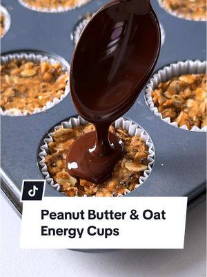 These no-bake energy cups are the perfect bite-size snack, packed with chunky peanut butter, fiber-rich oats and just the right touch of chocolaty sweetness for a boost of lasting energy. Ingredients - 1⅔ cups old-fashioned rolled oats - ¾ cup crunchy natural peanut butter - ½ cup unsweetened almond milk - 3 tablespoons chia seeds - 2 teaspoons honey - 1½ teaspoons vanilla extract - ¼ teaspoon salt - ½ cup dark chocolate chips (53% cacao)  - 1 tablespoon unrefined coconut oil - ¾ teaspoon flaky sea salt Directions 1. Line the cups of a 24-cup mini muffin tin with silicone or paper liners. 2. Combine 1⅔ cups oats, ¾ cup peanut butter, ½ cup almond milk, 3 tablespoons chia seeds, 2 teaspoons honey, 1½ teaspoons vanilla and ¼ teaspoon salt in a large bowl; stir to mix well. Divide the mixture among the prepared cups, about 1 heaping tablespoon each; firmly press the mixture into the cup bottoms. 3. Combine ½ cup chocolate chips and 1 tablespoon coconut oil in a small microwave-safe bowl. Microwave on High until the oil is melted and the chocolate chips have softened, 45 to 60 seconds. Stir until the chocolate chips are completely melted and incorporated into the oil. 4. Spoon a scant teaspoon of the melted chocolate mixture over the oat mixture in each cup, spreading to cover the entire surface. Refrigerate, uncovered, until the chocolate layer is beginning to set (the surface will begin to lose its shine and become dull), 10 to 15 minutes. Sprinkle with ¾ teaspoon flaky salt; refrigerate, uncovered, until chilled and the layers are fully set, about 1 hour. For full recipe information, go to our profile then click the likeshop link. From there, click on the image that corresponds to this video. #fyp #energycups #energyboost #peanutbutter #oats #reeses #magicshell #healthysnacks #healthysnackideas 