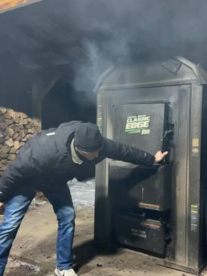 Loading the boiler in good clothes. Dodging smoke to not smell like a BBQ 🔥 #fyp #smoke #firewood #outdoorwoodboiler #centralboiler 