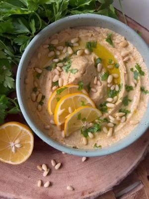 Roasted Lemon-Shallot Hummus. 🍋 🧅  Ohhhh Meyer lemons, how I love you! Organic Meyer lemons have a thin, flavorful, malleable skin that is great to cook with! So we’ll take the classic lemon-shallot flavor combo and take it up a notch!  Ingredients: 16 Oz Chickpeas 3 Meyer Lemons 1 Large Shallot 1/4 Cup Tahini 5-6 Cloves Garlic (or one head) 1/4 Cup plus 2 Tbs Olive Oil 1 Tsp Sumac (optional)* Salt and Pepper, to taste Chopped Parsley and Pine Nuts (optional topping) *Sumac is a beautiful, flavorful Middle Easten spice made from ground berries that adds complexity and depth! I highly recommend trying some! Mine is from @nyshuk  🍋 Preheat your oven to 375° and prep a lidded baking dish with a drizzle of olive oil. Halve and deseed your lemons, and thinly slice the shallot. Toss in olive oil, add salt and pepper, then a small splash of water and replace lid. If you are using garlic cloves you can toss them in with the lemons, but if roasted in their paper, I recommend roasting in a separate dish with the top sliced off to expose cloves then once again coating in olive oil and adding salt and pepper. Roast for about an hour, stirring every 15 minutes until shallots have broken down and the lemons are soft.  🍋 Scrape the entire baking dish into a food processor and add chickpeas (I prefer to de-skin them for a better texture), tahini, and sumac. Start to process, then as the mixture starts to move more slowly drizzle up to a 1/4 cup until the mixture is smooth.  🍋 Spread into a bowl, drizzle with olive oil, and top with fresh parsley and pine nuts if you have them on hand (pine nut and lemon is a *great* flavor combo!’ Store in an airtight container in the fridge for up to five days!  #recipes #hummusrecipe #hummus #immunesupport #immuneboost #meyerlemon #citrusrecipes #urbanhomestead #vegan #glutenfree #lowwaste #slowliving #fromscratch #denver #mealprep 