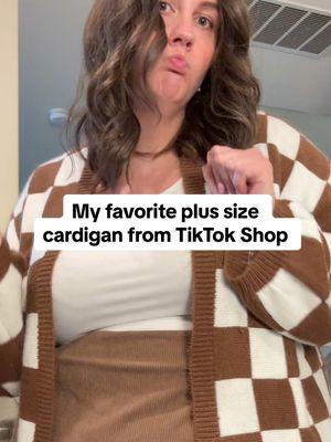 Replying to @Mel I found this checkered cardigan on TikTok shop and have nearly worn it weekly since I got it. It gives me a little confidence boost and changes my mood every time I wear it. I think I’m going to get the pink checkered one to wear with my Valentines Day t-shirts! #plussizecardigan #checkeredcardigan #apronbelly #apronbellybaddies #plussizefashion #plussizeoutfitinspo #plussizewinterfashion #winterfashion #outfitinspo 