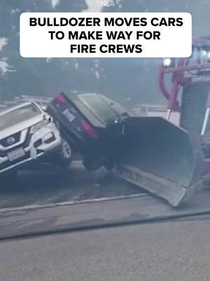 As winds are expected to peak in the early hours of Wednesday and red flag warnings are in effect for many cities, officials are being forced to use any means to clear the way to access burning areas. This video shows a #bulldozer moving #cars to make way for #fire crews in the #PacificPalisades area. #californiafire #fires