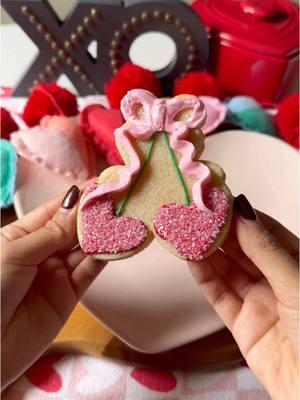 Coquette vibes with these sugared heart cherries and piped royal icing bow for this Valentine’s Day cookie design 😍🍒🎀  #ValentinesDay #cookies #sugarcookies #royalicingcookies #royalicing #cookietutorial #cookievideo #tutorial #baking #baketok #cookiesoftiktok #decoratedcookies #cookiedecorating 