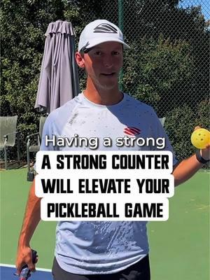 Go follow me for more✅ Master the counter game! A strong counter isn’t just a defensive move—it’s a way to keep your opponents constantly guessing and hesitant to attack. Here's how to perfect it: 1️⃣ Stay Ready with Your Paddle Up: Always keep your paddle up and "scanning" the ball. Wherever the ball goes, your paddle tip follows. Whether the ball is on the left, right, or in front of you, your paddle should always be tracking it. 2️⃣ Find YOUR Ready Position: Most players like keeping my paddle tip in front of me, but some players prefer tilting towards their backhand. Continental grip players may favor the backhand, while Eastern grip players might center or favor the forehand. Experiment and stick to what works for YOU. 3️⃣ Read Body Language: Watch your opponent closely. If their paddle starts to pull back, expect a fast shot and get ready to counter. If they surprise you with a dink, no worries—just drop your paddle down to adjust. The secret sauce? Stay alert and treat every ball like it’s coming at full speed. The better you anticipate and stay ready, the more control you’ll have on the court! #pickleball #selkirksport #selkirk #selkirkedit #wearepickleball #crackedpb