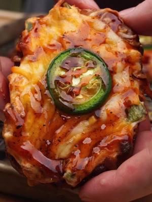 Start your day with jalapeño popper hashbrowns 🌶️ Ingredients: • ½ package hashbrown patties, frozen • 1 (8 oz.) block cream cheese • 1-2 jalapenos, diced + a slice for each hashbrown • 3-4 slices cooked bacon, diced • 1 C shredded cheese • ¼ C BBQ sauce + more to garnish • BBQ seasoning   Procedure: 1. Preheat the grill to 400 degrees. Meanwhile, mix the cream cheese, jalapenos, bacon, half of the shredded cheese, and bbq rub in a bowl until well combined. 2. Place the hashbrown patties on a wire rack. Once the grill has preheated, add the hashbrowns to the grill and allow them to bake until crisp, flipping halfway through. Once the hashbrowns have started to crisp up, remove them from the grill. 3. Top each hashbrown with the jalapeno popper mix, then add the remaining cheese. Return the loaded hashbrowns to the grill. Cook until the cheese has melted, then remove from the grill. 4. Finish them off by garnishing with BBQ sauce and sliced jalapenos, then serve & enjoy! . Share this with someone who needs to make these for breakfast! 🔥 . Made on my @oklahomajoes pellet grill with @bearmountainbbq pellets #JalapenoPoppers #Hashbrowns #BreakfastOnTheGrill #BBQRecipe #ComfortFood #BoldFlavors #GrillMasters #BBQLife #GameDayFood #flavorfulrecipes 