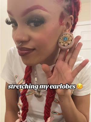 i loooove the process of stretching 🥲 #foryou #foryoupage #fyp #pyf #fypage #for #you #page  #stretchedears #stretchedearlobes #stretchedlobes #gauges #plugs #bodyartforms #bodymod #bodymodifcations #alttok #alternativetok #alternativetiktok #blackalt #blackalttok #blackalttiktok #redhair 