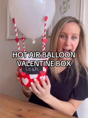 HOT AIR BALLOON VALENTINE BOX Supplies: • 1 Basket or Box • 1 Balloon • 4 Straws • Heart Shaped Paper Cutouts • Black Construction Paper • Silver Sharpie • Glue Gun   Watch the video to see how I made it! #valentinesdaybox #valentinesdayideas #valentinesdaycraft #vday #valentinecraft