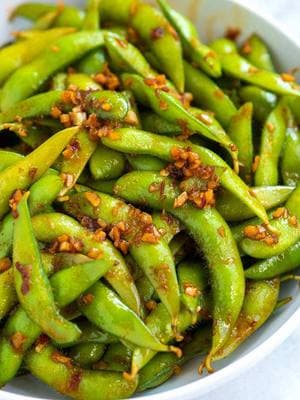 ✨ridiculously simple SPICY EDAMAME!! It tastes incredible, thanks to garlic, ginger, and a spicy chili sauce. This is truly one of my favorite edamame recipes! I can’t get enough. ⭐️⭐️⭐⭐⭐️ “Absolutely perfect...so flavourful !! Love the sauce” - Kaveri ✨ recipe is linked in our bio: @inspiredtaste  1 pound fresh or frozen edamame in their pods 1 tablespoon avocado oil or other neutral oil 1 tablespoon minced garlic 1 tablespoon minced fresh ginger 2 tablespoons light soy sauce or tamari 2 to 3 teaspoons pure maple syrup, sugar or honey 1 teaspoon toasted sesame oil 1/2 to 1 tablespoon Sambal Oelek or Sriracha #inspiredtaste #EasyRecipes #simplerecipes #foodblogeats #edamame #garlic #ginger