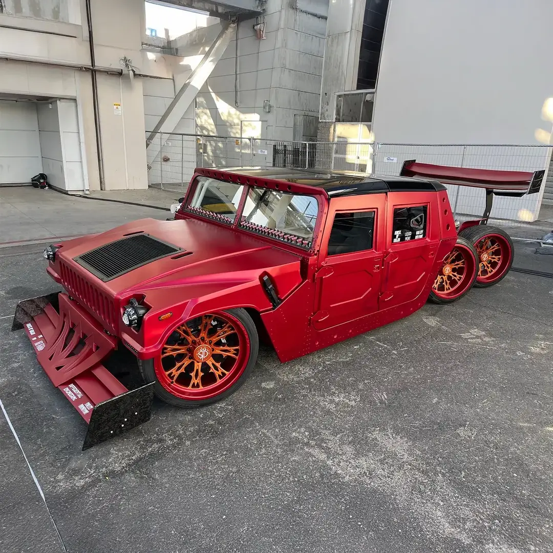 Meet "Seis Diablo," a 2012 AM General #Humvee turned F1-style #6x6 beast! Selling with No Reserve at the 2025 #Scottsdale Auction, Jan. 18-26 at #WestWorld, this mid-engine, fire-breathing SUV packs an LT4 #supercharged crate engine, a custom-built chassis, six-wheel steering and #crabwalk mode. Its #HouseofKolor #Kandy Firestorm paint, air-ride suspension and one-off 24-inch @JTX Forged wheels make it a one-of-a-kind showstopper. From the raked windshield to its #F1-inspired exhaust, this ride screams next level. Who’s ready to ride with the devil? Learn more on our website. 