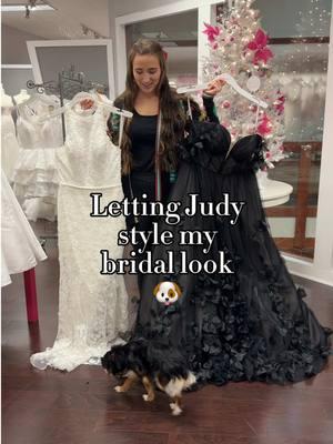 She’s lucky she’s cute cause her fashion sense could use some work… 😆🐶💕 #bridetok #blackweddingdress #shopdog #weddingdressshop #styleme #pickmyoutfit 