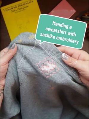 Learn how to embroider a sashiko pattern to mend a sweatshirt using wash away stick ‘n stitch guides.  #visiblemending #mendtok #mendwithme #sashiko #sashikostitching 