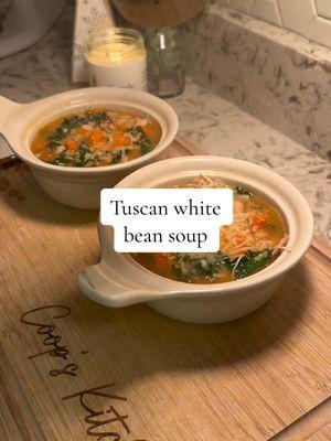 Recipe--> 🍲🥫✨ It snowed for three days straight, so a big pot of soup was on my mind 😌  This Tuscan white bean soup is a comfort healthy dinner that will warm you right up. Best part is you will have lots of leftovers (trust me you're going to want them)!  Can also be made vegetarian by doubling the beans and omitting the chicken!  Ingredients: -olive oil -1 white onion diced -6 cloves of garlic finely chopped -3 carrots diced -4 c cooked chicken (I used rotisserie for convenience!) -14oz can of cannellinni beans -14oz can diced seasoned tomatoes -32 oz low sodium chicken broth -2 c water -2 c brown quick rice (if using different rice, you will need to cook soup longer) -4 c kale de-stemmed and chopped -salt & pepper -1 bay leaf -Itailian seasoning  optional: -shredded parm  -crackers Steps: 1. In a large pot with 2 tbsp olive oil, add onions, garlic, & carrots and season with Italian seasoning, salt & pepper. Cook for 3-4 minutes stirring regularly until onions start to become translucent. 2. Add beans, diced tomatoes, chicken, bay leaf, broth & water and bring to boil 3. Once boiling, add rice and lower heat to simmer. Let cook for 10 minutes 4. After 10 minutes, add kale and let cook for another 3-4 minutes  5. Serve with shredded parm and crackers  Enjoy!! #tuscanwhitebeansoup #soupseason #souprecipe #healthysoup #chikensoup #whitebeansoup #healthymeals #healthyrecipes #healthydinner #healthymealprep  #weightlosssoup #weightlossmeals #75hard #coopskitchen #coopeatsfirst #glutenfreesoup #dairyfreesoup #pcosrecipes 