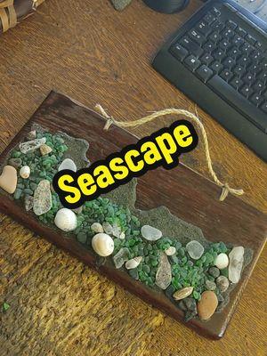 I call it the Reclaimed Wood Seascape Wall Art and it's now available on my Etsy shop. link in my bio. 🐺🌊🥃🏴‍☠️ #seawolf #pirateheathen #seawolfartisan #houseofseawolf #etsy #fyp #beach #nautical #coast #seaglass #seashell #wallart 