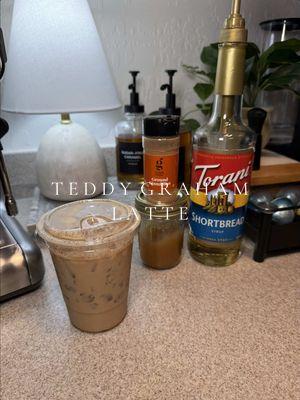 TEDDY GRAHAM LATTE 🧸🍯 no one come for me because I poured the espresso over the ice okay?? the drink was delicious 🙂‍↕️ #coffee #coffeetiktok #icedlatte #teddygrahams #teddygrahamlatte #espresso #coffeeathome #honeycinnamon 