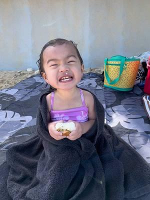 Livin her best life eating a spam musubi on the beach🤙🏼🌞 #hawaii #beach #livingmybestlife #musubi #spammusubi #toddlersoftiktok #friday #vibes #snack #local #FoodLover #foodtiktok #foodies #fy #fypシ゚viral #fyp #growingup 