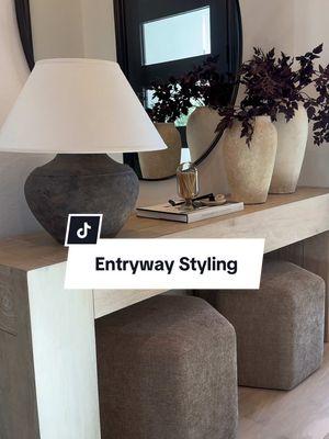 💫 Let’s talk entryway styling ☺️ To achieve balanced scaling in a room, incorporate larger accessories like vases to create visual harmony. Smaller accessories can make a space feel cluttered, as they often require more items to fill empty areas. In larger spaces, choose larger furniture pieces, such as my 72-inch console table, which surpasses the standard length at around 60 inches. 🤎 For smaller spaces, select furniture with greater depth and height to create the illusion of larger-scale pieces. 🫶🏽 #entrywaydecor #decor #homedecor #interiordesign #livingroomdecor #livingroom #consoletable #design #homedesign 