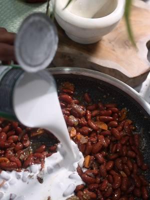 Can't go wrong with a hearty plate of Stewed Peas🥣🫘🍚 -simple wholesome and perfect for little tummies TRY THE RECIPE⬇️⬇️⬇️ Ingredients:  1 can red kidney beans drained 1 cup coconut milk (unsweetened) 1 small piece of fresh thyme 1 clove garlic, minced 1 small onion, chopped 1 small carrot thinly sliced  1/4 tsp ground allspice  2 tsp mixed herb seasoning blend Pinch of salt to taste  1/2 cup all-purpose flour and water for dumplings (optional)  Instructions: In a pan, add your chopped onion carrots and garlic and sautee until soft. Next, add your herb seasonings, thyme, beans and coconut milk. Bring to a simmer on low-medium heat. If adding dumplings : In a small bowl, mix flour with a little water to form a dough. Roll small portions into thin, finger-like shapes. Drop the dumplings into the simmering pot.  Let everything cook for another 15–20 minutes, stirring occasionally, until the stew thickens and the dumplings are cooked through. Cool slightly and serve as a hearty one-pot meal or alongside a small serving of rice for extra toddler-friendly texture.  Cooking Tips ✨️  Season to Taste: Add a pinch of salt or an extra splash of coconut milk for a creamier finish if needed.  Perfect Consistency: If the stew feels too thick/dry, gradually stir in chicken stock until you reach your desired consistency.  Rich Color: It takes time for the stew to develop its signature reddish-brown color. Let it simmer low and slow—but if you’re in a pinch, a small dash of ketchup can help enhance the color naturally. ***For younger babies, smoosh the peas slightly before serving so it's easier for them to manage*** #toddlerfoodideas #toddlermomsoftiktok #toddlerfood #toddlerfoodideas #cookwithme #stewpeas 