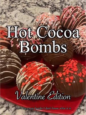 Hot cocoa just got sweeter! These Valentine’s Hot Cocoa Bombs are the perfect way to cozy up this season. Made with love (and lots of chocolate), they’re filled with cocoa mix, marshmallows, and chocolate chips, then decorated with festive drizzles and sprinkles. Simply drop one in a mug, pour hot milk over it, and watch the magic unfold. Stir and enjoy a creamy, chocolatey treat perfect for warming hearts this Valentine’s Day! Supplies Needed: • Melting chocolate (milk, white, or your choice of colors) • Hot cocoa powder • Marshmallows • Chocolate chips (milk, white, or semi-sweet) • Festive sprinkles (red, pink, hearts, etc.) • Silicone sphere molds • Pastry scraper How They’re Made 1️⃣ Chocolate Shells: Melt chocolate and coat the silicone molds evenly. Use a pastry scraper to clean the edges of the molds for a smooth finish. Refrigerate for 10-15 minutes until set. 2️⃣ Fillings: Add cocoa mix, marshmallows, and chocolate chips to one half of each shell. 3️⃣ Sealing: Warm the edge of the other half on a plate or pan, press together, and seal. Smooth with melted chocolate if needed. 4️⃣ Decorate: Drizzle with chocolate and add festive sprinkles. Let set completely. To Use: Place a hot cocoa bomb in a mug, pour steaming milk over it, and watch it melt into chocolatey goodness. Stir and enjoy! These make adorable gifts for friends, family, or someone special. They’re as fun to make as they are to drink! #ValentinesHotCocoa #HotCocoaBombs #ChocolateLovers #ValentinesDayTreats #CozyDrinks #DIYHotChocolate #SweetGifts #HolidayDesserts #ChocolateBombs #HomemadeLove #CocoaBombs #WinterTreats #ValentinesDayIdeas #FestiveDrinks #WarmAndCozy #DeliciouslyBold