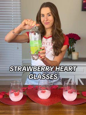 V-DAY STRAWBERRY HEART GLASSES🍓 These  festive glasses are so fun to make for a Galentine’s get together!  SUPPLIES: -Strawberries -Clear glasses -Skewers -Twine -Scotch tape -Clear drink of choice- I used sparkling water DIRECTIONS: 1. Slice your strawberries in half. 2. Carve out a heart shape. 3. Insert skewers into strawberries. 4. Tie twine around skewer. 5. Tape twine off on each side of glass to secure strawberry in the middle. 6. Pour a little water in that comes above the bottom of the strawberry so that it freezes in place. 7. Freeze. 8. Remove tape and twine. 9. Skewer broke off for me at the tip of strawberry with no wood showing.  10. Pour in your drink and enjoy! #valentines #ValentinesDay #vday #vday2025 #valentinesideas #valentinesdayideas #valentinesdaydrinks #valentinesdrink #valentinesdaycrafts #valentinesdiy #valentinesdecor #diyvalentines #valentinesparty 