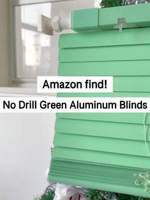 No Drill Green Aluminum Blinds. ✨ Aluminum design provides a touch of sophistication while resisting harsh sunlight. No-drill quick installation is ideal for renters and homeowners, leaving no marks and preserving walls. Instantly elevate the ambiance of your room while protecting it from the sun! Click the link in bio🔗 to learn more. #homedecor #interiordesign #homestyling #aluminumblinds #sunresistant #nodrill #NoDrillBlinds #HomeUpgrade #moderndecor #homediy #windowtreatments #amazonhomefinds #apartmentdiy #livingroomstyle #blinds 