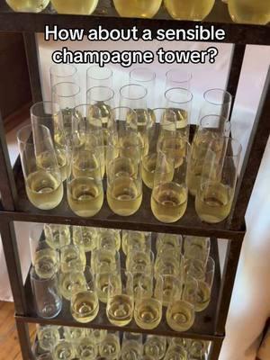 Champagne tower anyone? Simple is always best right? We have also used these for signature welcome cocktails 😉#champagnetoast #champagnetower #weddingideas #weddingbar #weddingtok #wedtok 