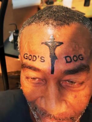 God's dog lettering Jesus Christ crucifixion forehead face tattoo tattoo artist  - Mark Martin #tattooideas #tattooideasformen #besttattoos #worldsbesttattoos #facetattoo  #foreheadtattoo #jesustattoo #crucifixion #viral #jesuschrist #godsdog 