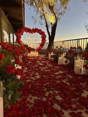 Will You Marry Me? 🌹💍  🌹✨ We had the incredible honor of creating a stunning engagement setup for a beautiful couple! With a backdrop of breathtaking views, vibrant red roses, and the warm glow of candlelight, their “yes” was perfectly framed by a magical sunset. Every detail was designed to make their moment unforgettable. Congratulations to the happy couple! 💍❤️ #EngagementSetup #ProposalGoals #LoveStory #WeddingVendors #RomanticDecor #SunsetProposal #Engaged #EventDesign #CandlelightDinner #RedRoses #WeddingInspiration #CoupleGoals #MagicalMoments #WeddingPlanning #ForeverStartsNow #fyp