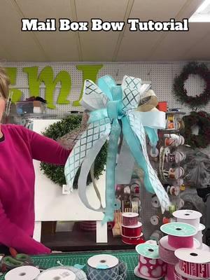 Make a winter bow with Lorie! This bow is going to look great on a mailbox.  Shop ribbons at tmigifts.com #mailboxbow #bowmaking #bowtutorial 