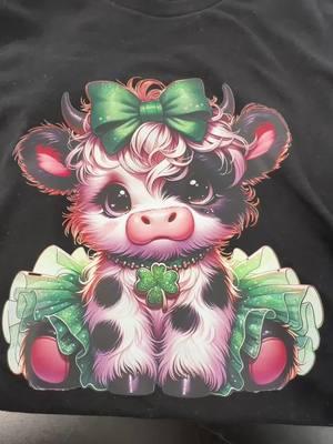 Absolutely adorable cow cutie for St. Patty’s Day #stpattys #cutecow #stpatricksdaytshirt #highlandcowtee 