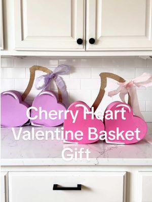 "Cherry Heart Valentine Basket fun, over-the-top twist on the usual Valentine's Day basket-one my girls will never forget! No fancy skills needed-just painting, cutting, and glue-gunning (my happy place l). Perfect for moms, crafters, and creators of any level! Plus, we used our fav @Cheek 2.0 craft mat (best quality + lifetime guarantee I personally believe  to this day since when I first discovered the brand back in 2020) #sponsored Want to make your own? Here's what you'll need: -Heart paper mache boxes x2 -Acrylic paint (your fave color) -Gold glitter card stock -Pink streamers -X Floral wire + glue gun -Scissors #valentinebasket #valentinediy #craftingtok #momcrafts #valentinesgiftideas 