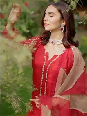 Anmol | A stunning red shirt delicately adorned with crystals along the neckline and featuring statement sleeves tailored on an intricately worked mesh. It is paired with a tulip shalwar laced with gota and a sheer dupatta with red and beige panels Shop now: www.shramya.com #shramya #anmol #gulbahaar #shramyacollection #festivewear #custommade #maketoorder #salwarsuits #salwaarkameez