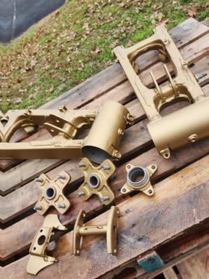 Three wheeler parts sauced up in gold and matte clear @Prismatic Powders #gold #3wheeler #honda #2stroke #offroad #powdercoating #fyp 