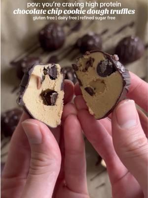 These Chocolate Chip Cookie Dough Protein Truffles are gluten free, dairy free, paleo, high protein, and refined sugar free, and so easy to make. They’re the perfect healthier, high protein treat! Cookie Dough: •3/4 cup cashew butter •1 tsp vanilla extract •1/4 tsp salt •1/4 cup coconut flour (or almond or oat flour or cacao powder — see recipe notes) •1/4 cup plant based vanilla protein power (I used Truvani) •1/3 cup dairy free chocolate chips (I used 100% cacao) Chocolate Shell: •1/2 cup dairy free chocolate (e.g. Hu Kitchen chocolate gems) •1/2 tbsp coconut oil OR •1/3 cup 100% cacao chocolate chips •1 1/2 tbsp coconut oil •2 tbsp room temperature maple syrup or honey Instructions: 1. Add the cashew butter, vanilla, and salt to a bowl and mix then add in the coconut flour, protein powder, and chocolate and mix until a dough forms. Add more flour if it’s too wet or more cashew butter if it’s too dry. 2. Scoop the dough and roll into balls then place the ball on a tray lined with parchment paper and freeze for 30 minutes. 3. After 30 minutes, melt the chocolate and coconut oil together (on the stovetop using the double boiler method or in the microwave). If using unsweetened chocolate, remove from the heat and stir in the maple syrup or honey. 4. Remove the balls from the freezer and coat in melted chocolate then return to the tray. Sprinkle with coarse sea salt then place in the fridge until the chocolate hardens, then dig in and enjoy! Recipe Notes •if using almond flour, use 1/3 cup •if using oat flour, use 1/4 cup + 2 tbsp •if using cacao powder, use 3/4 cup #cookiedough #ediblecookiedough #proteincookiedough #proteinballs #truffles #chocolatechipcookiedough #proteintreats #nobakedessert #vegantruffles #dairyfreedessert #healthydessert #refinedsugarfree #sugarfree 